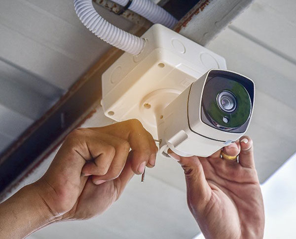 CCTV camera installing near me, technician installing CCTV, CCTV security installations near me. 