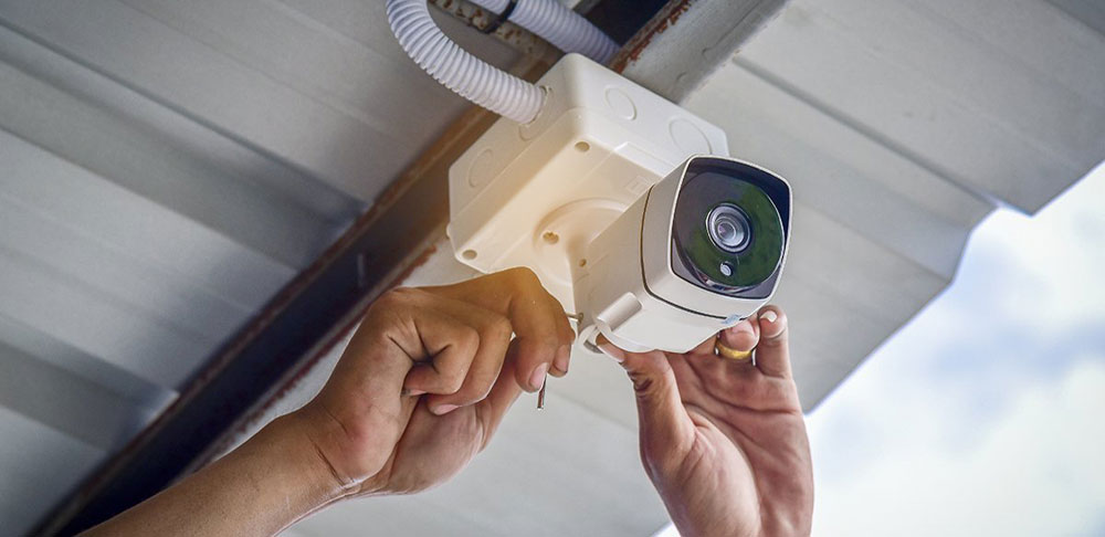 CCTV camera installing near me, technician installing CCTV, CCTV security installations near me. 